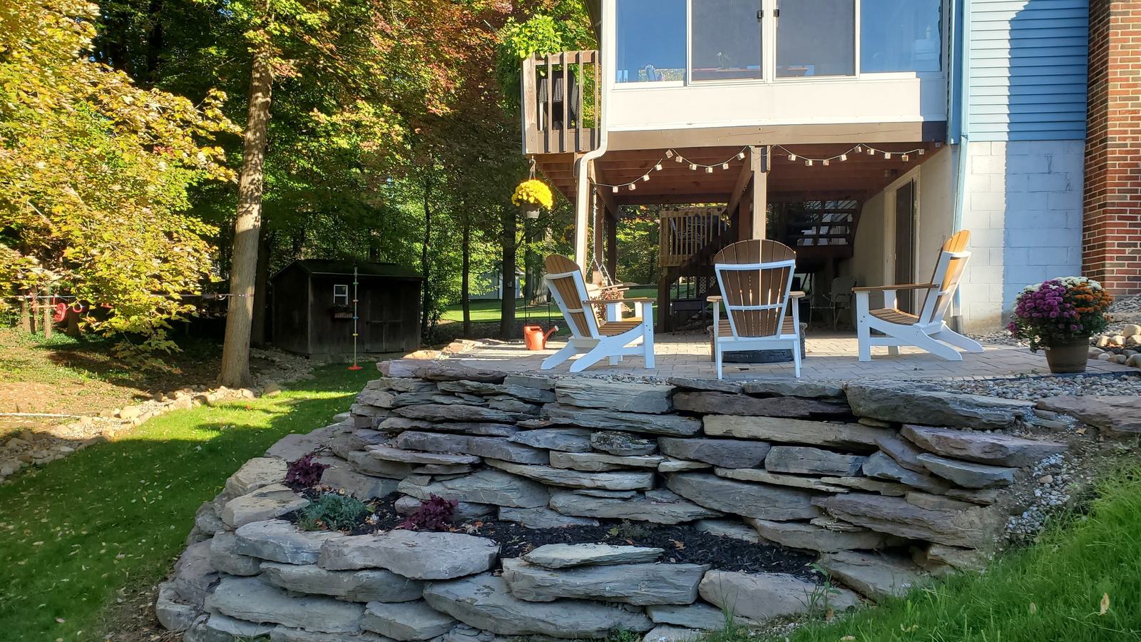 Dry-stacked natural stone terrace and seating area on a job in Portage County, Ohio